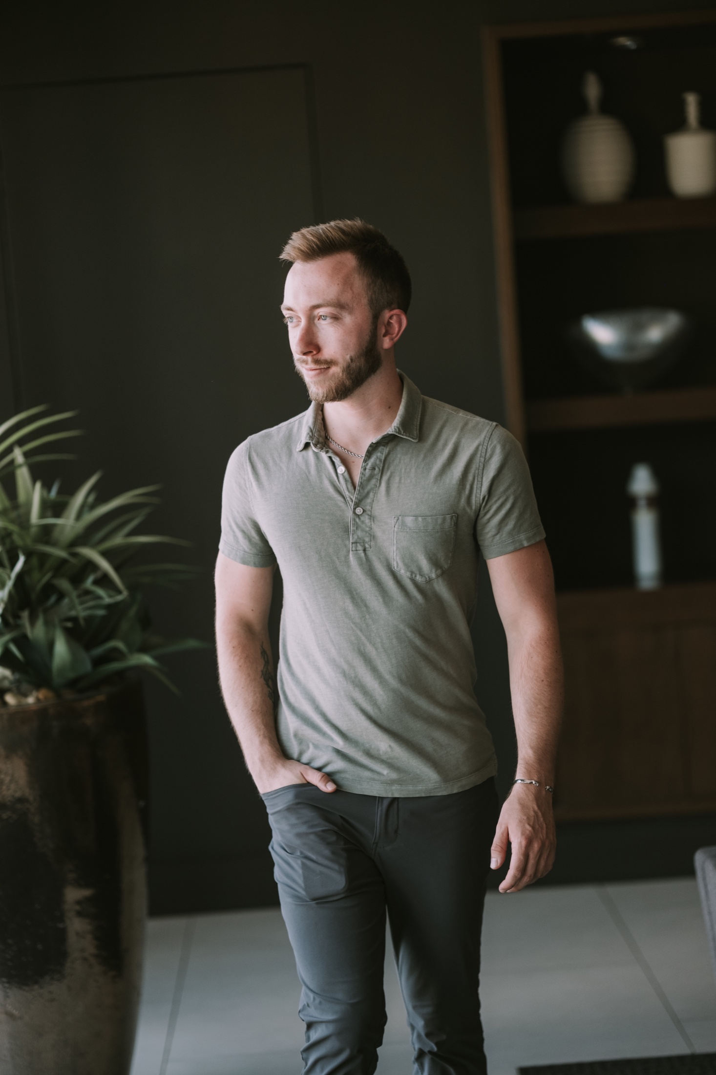 Brian Oliver in a dark, architectural interior